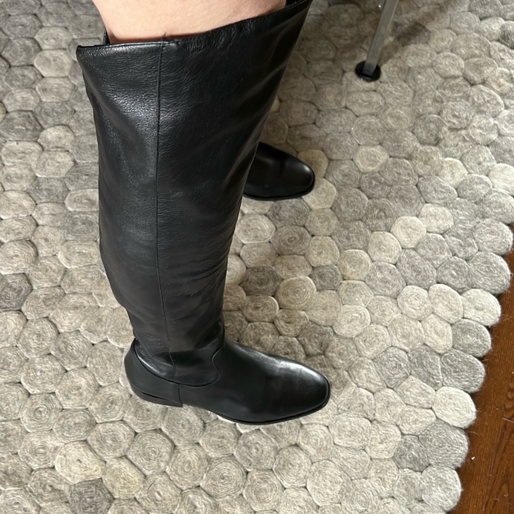 Black knee high inner zipper boots size 9. Brand new never worn.